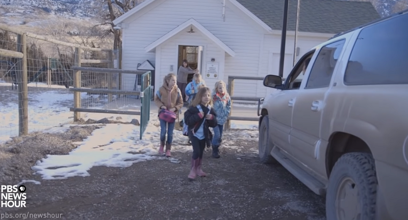Children exiting the one room schoolhouse in Cody, Wyoming.