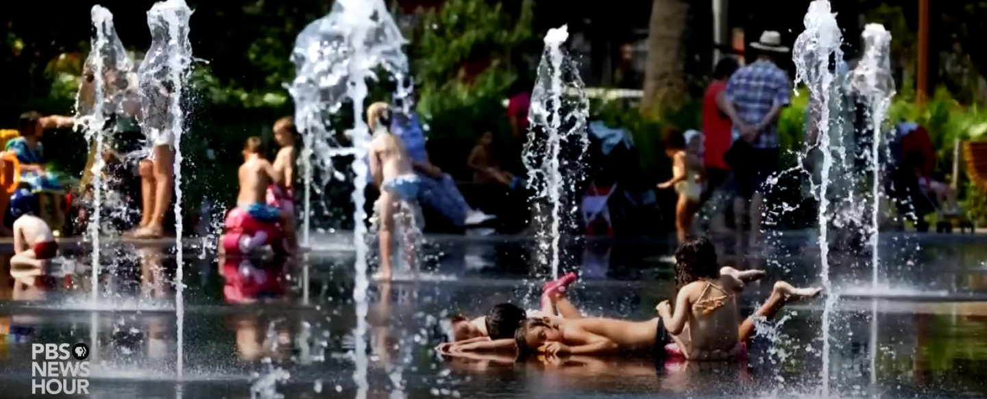 children play in a fountain during the european heatwave